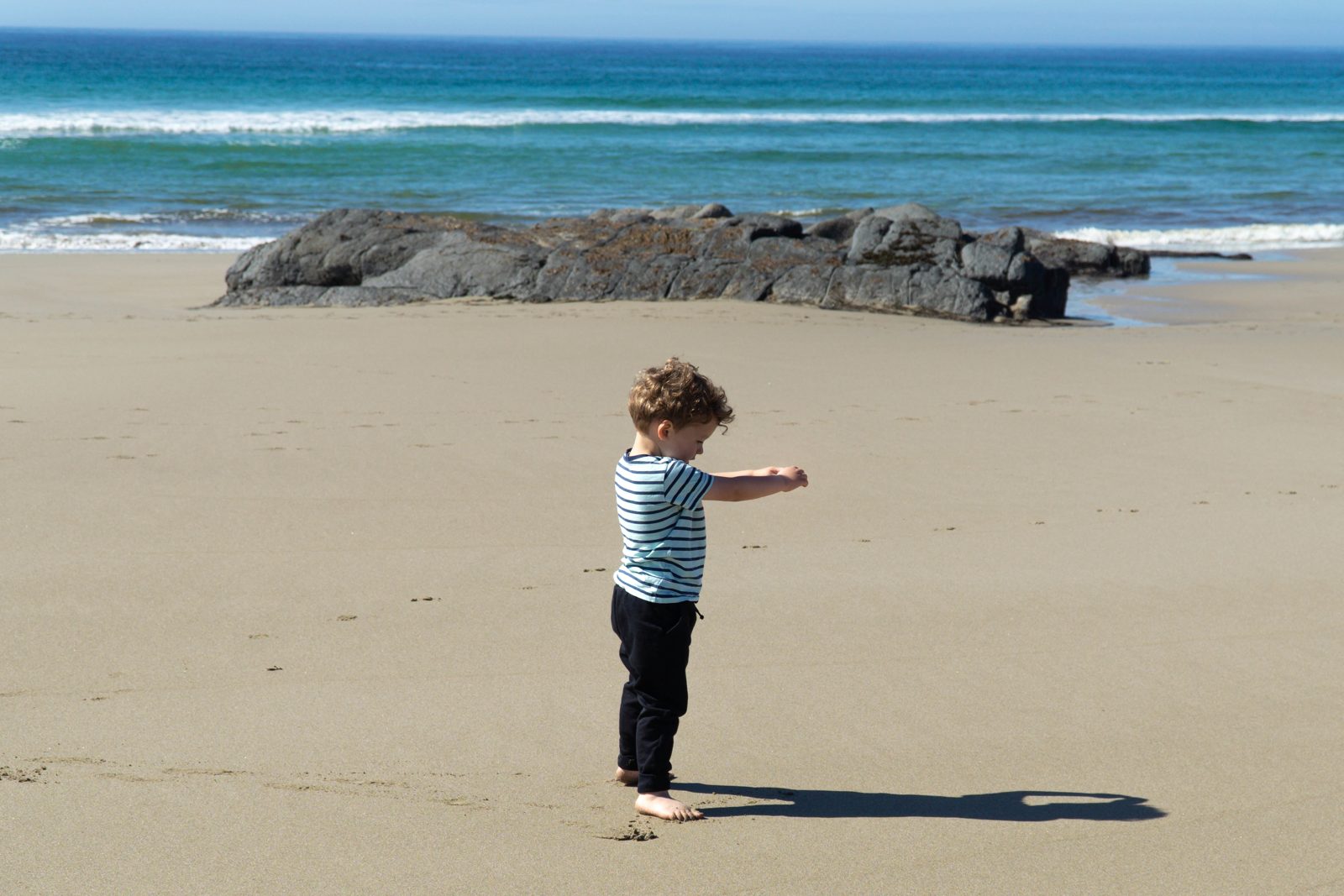 Child playing on a sandy Islay beach